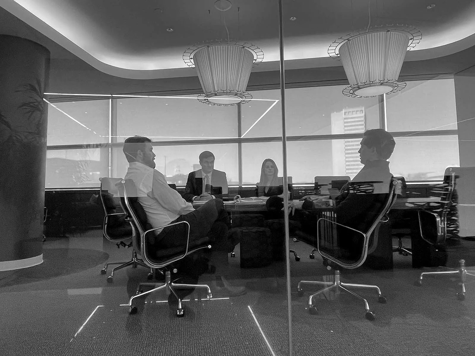 Ironside attorneys meeting in a glass-walled conference room